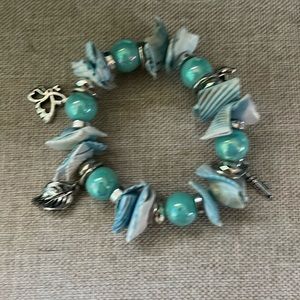 Teal charm bracelet. Cute and beachy.